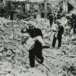 1945 - Firefighters carry children to safety