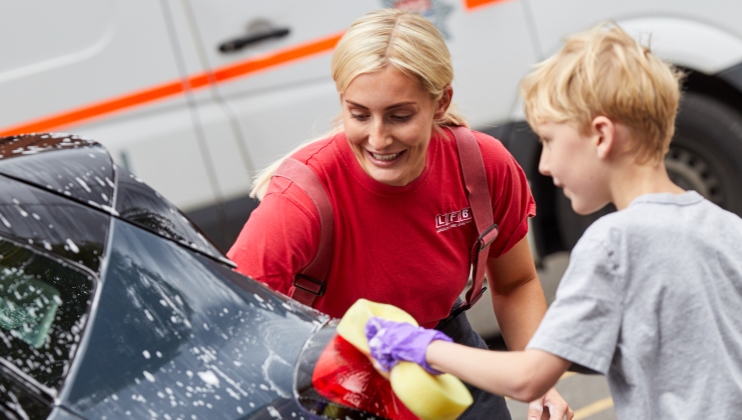 LFB car wash femal firefighter and boy