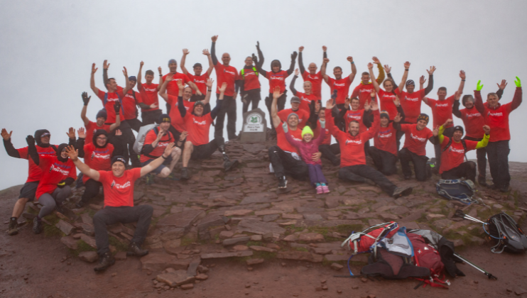 Colleagues complete 10 peaks challenge in memory of friend