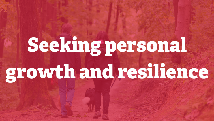 Two people walk with a dog on a forest trail surrounded by trees. Overlaid text reads: "Seeking personal growth and resilience." The image has a red filter.