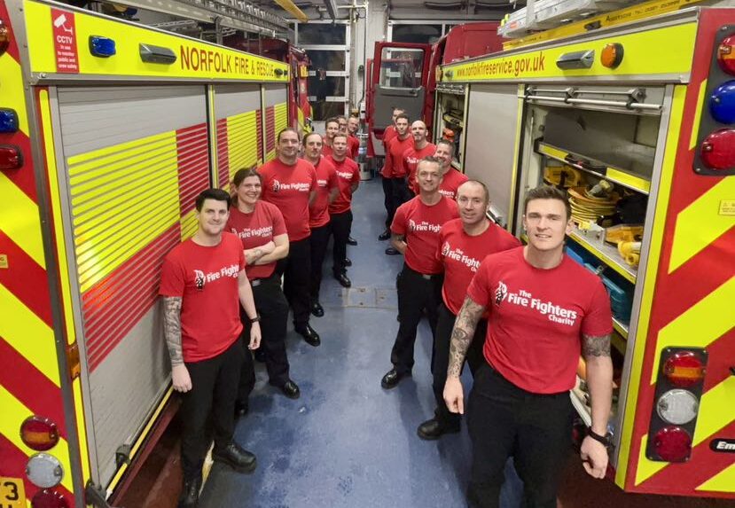 A group of firefighters in red 