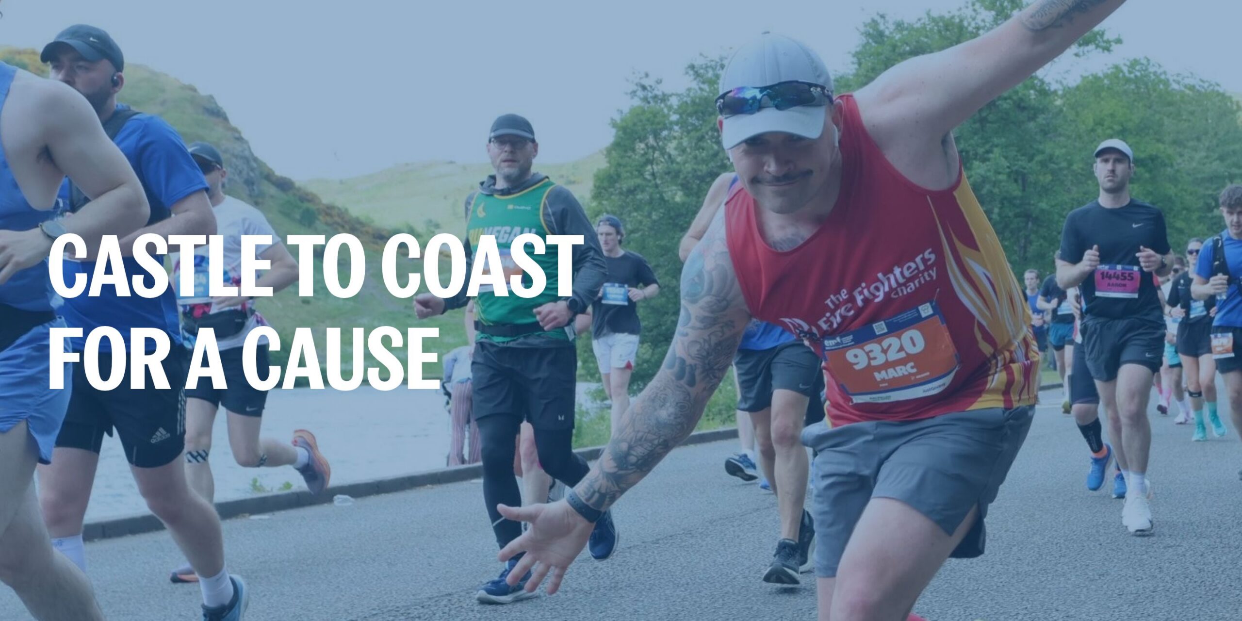 A group of runners on a road race, with a man in a red tank top reaching toward the camera in the foreground and the text “CASTLE TO COAST FOR A CAUSE” overlaid on the image. 